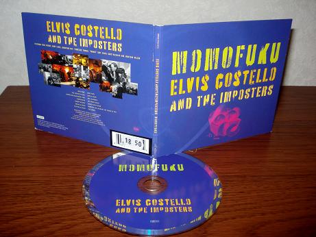 33 Elvis Costello & The Imposters - Momofuku