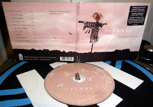 the pines, dark so gold